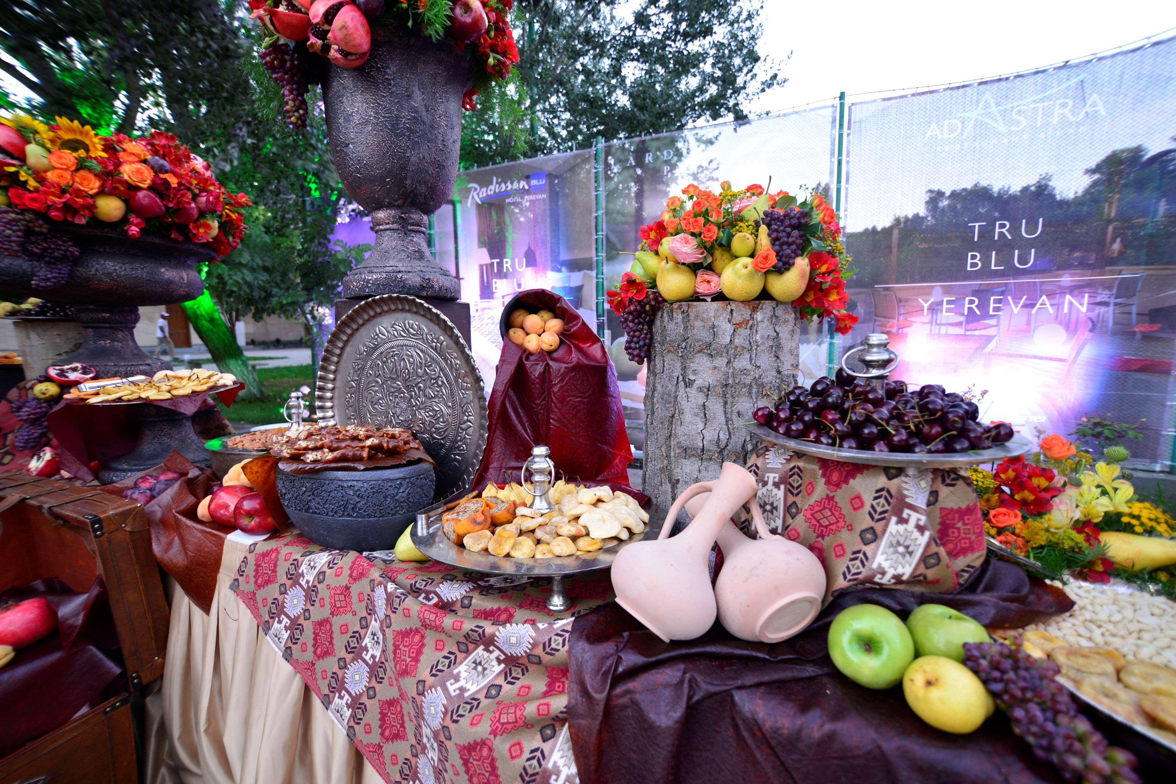 Radisson Blu Hotel Yerevan Exterior photo A traditional Armenian table with fruit and wine