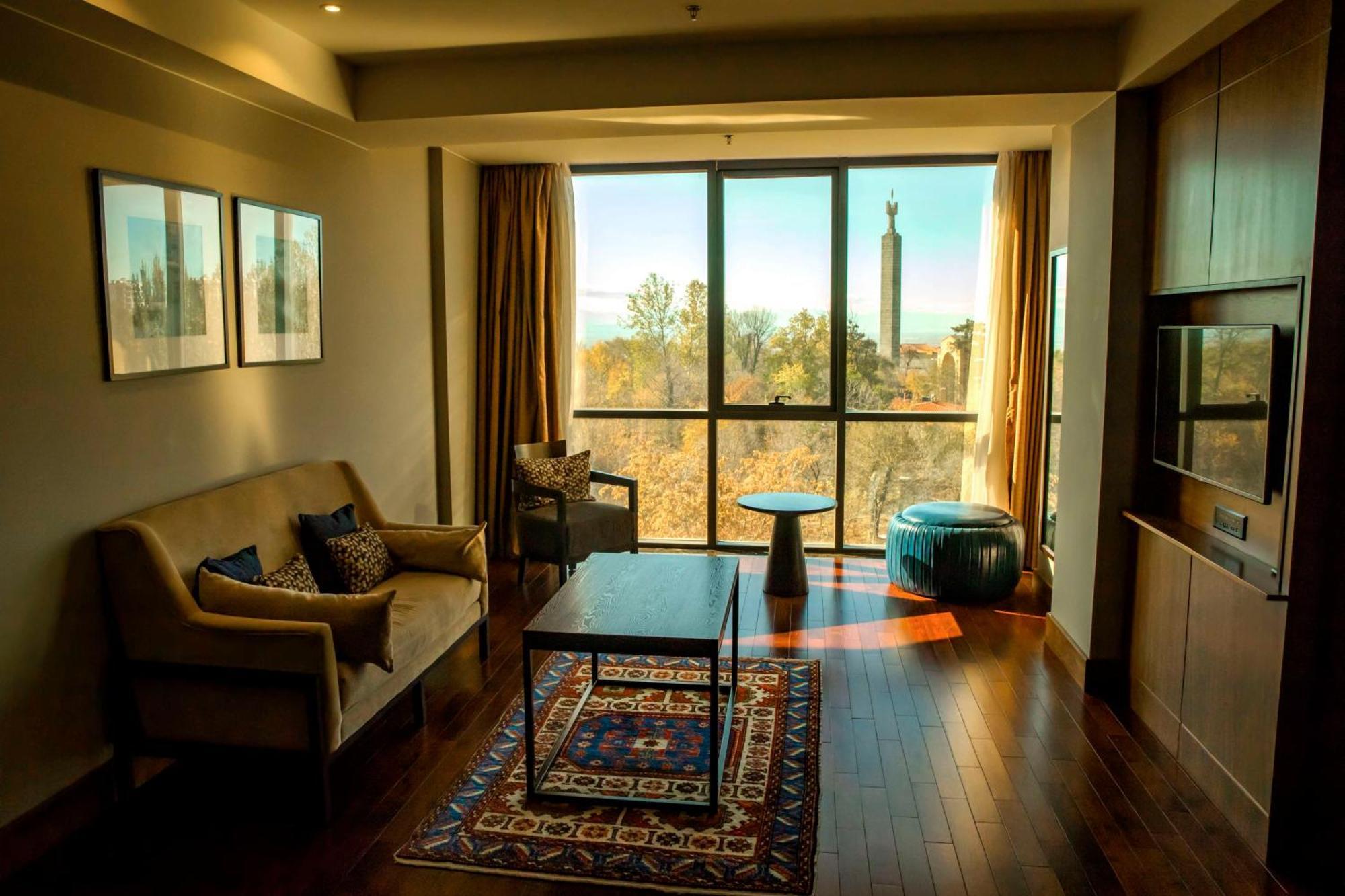 Radisson Blu Hotel Yerevan Exterior photo A living room in a suite at the Hilton Johannesburg